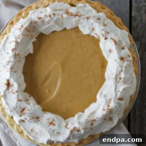 32 Christmas Pie Delights 23 A festive Gingerbread Cream Pie, embodying the flavors of the holiday season.