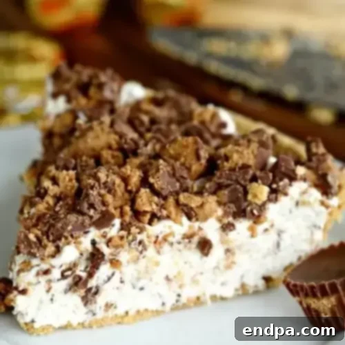 32 Christmas Pie Delights 3 A tempting slice of Reese's pie on a plate, rich with peanut butter and chocolate.