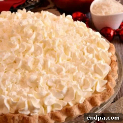 32 Christmas Pie Delights 5 A creamy White Christmas Pie, beautifully adorned and ready for festive celebrations.