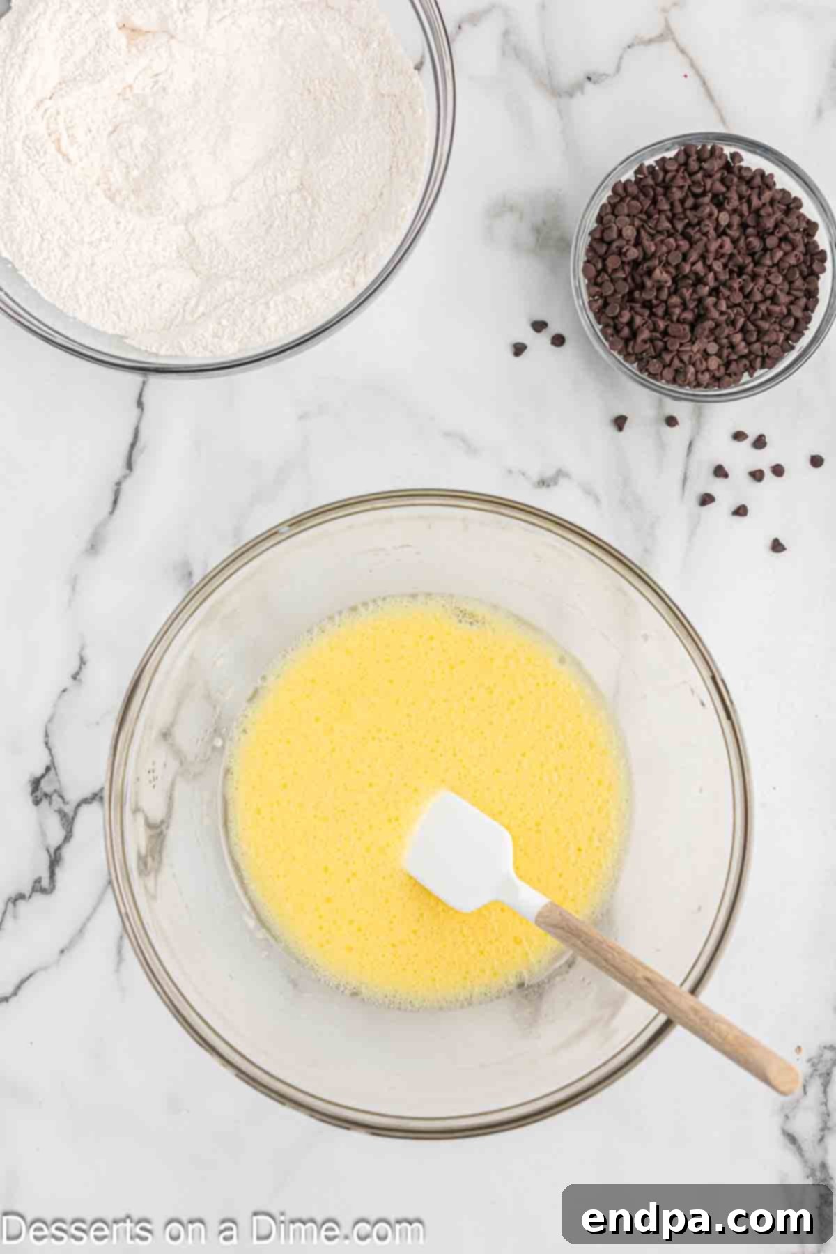 Decadent Chocolate Chip Cupcakes 5 Mixing bowl with wet ingredients.