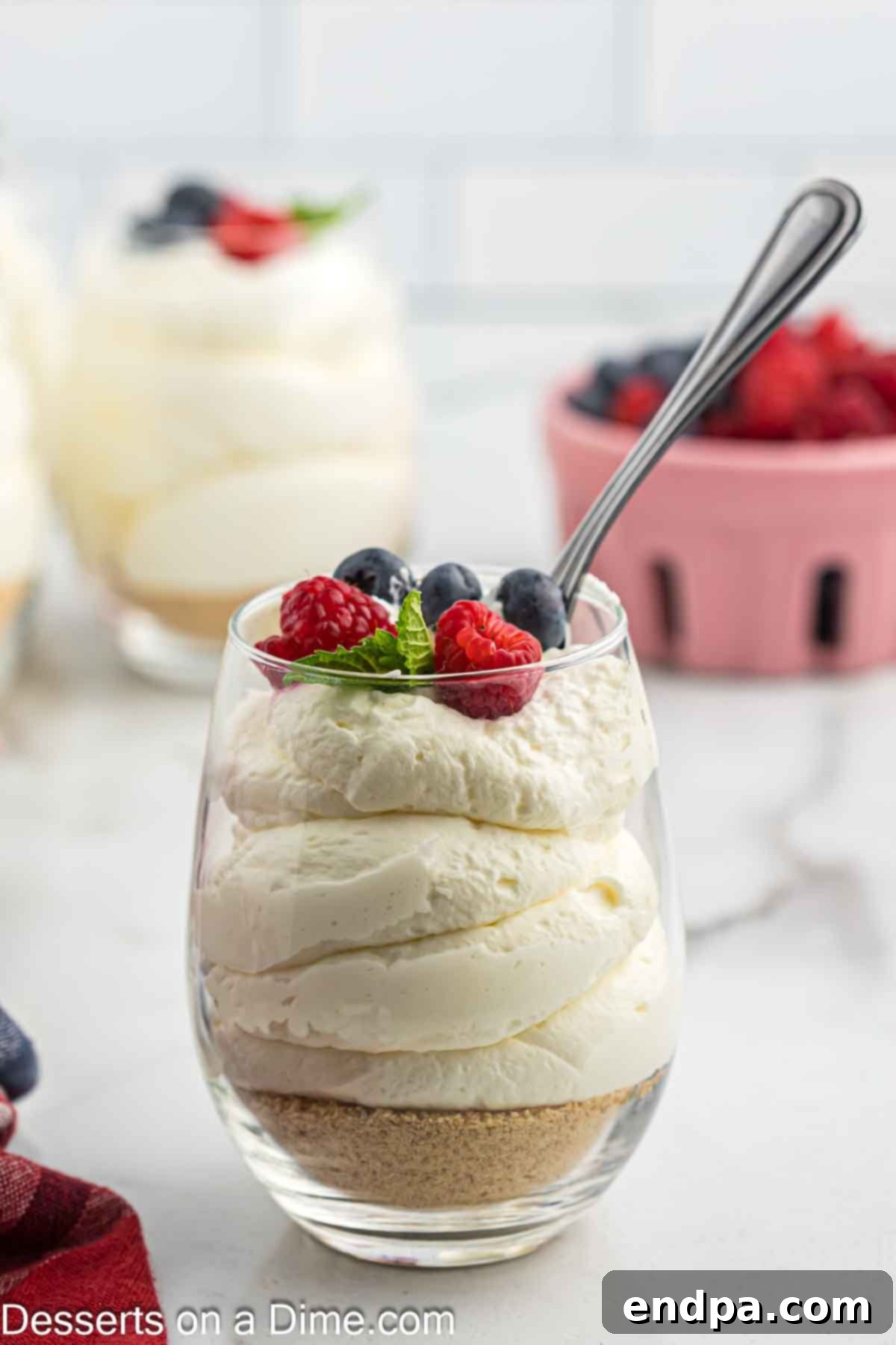 A perfectly prepared cup of cheesecake mousse, ready to be enjoyed.