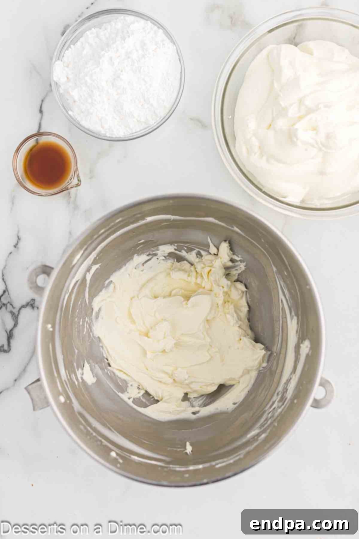 The freshly whipped cream is transferred to a separate bowl and set aside.