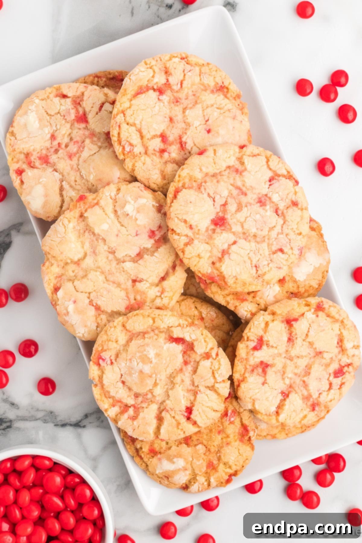 Sizzling Indulgences 2 Red Hot Cookies stacked on a platter, showcasing their vibrant color and inviting texture.