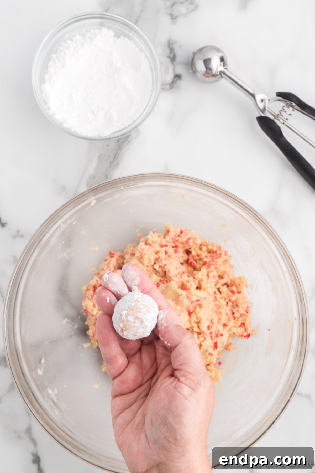Sizzling Indulgences 8 Cookie dough rolled into small balls and ready for baking.