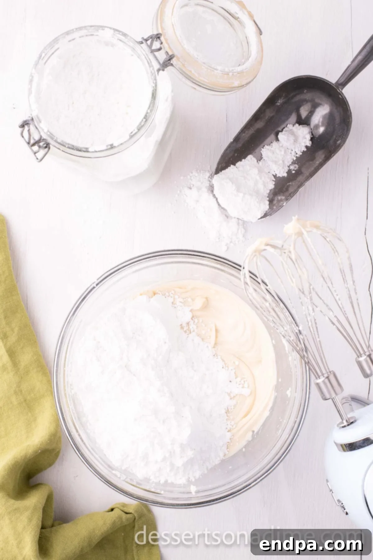 Velvety Maple Cream Cheese Frosting 6 Powdered sugar mixed into the cream cheese mixture.
