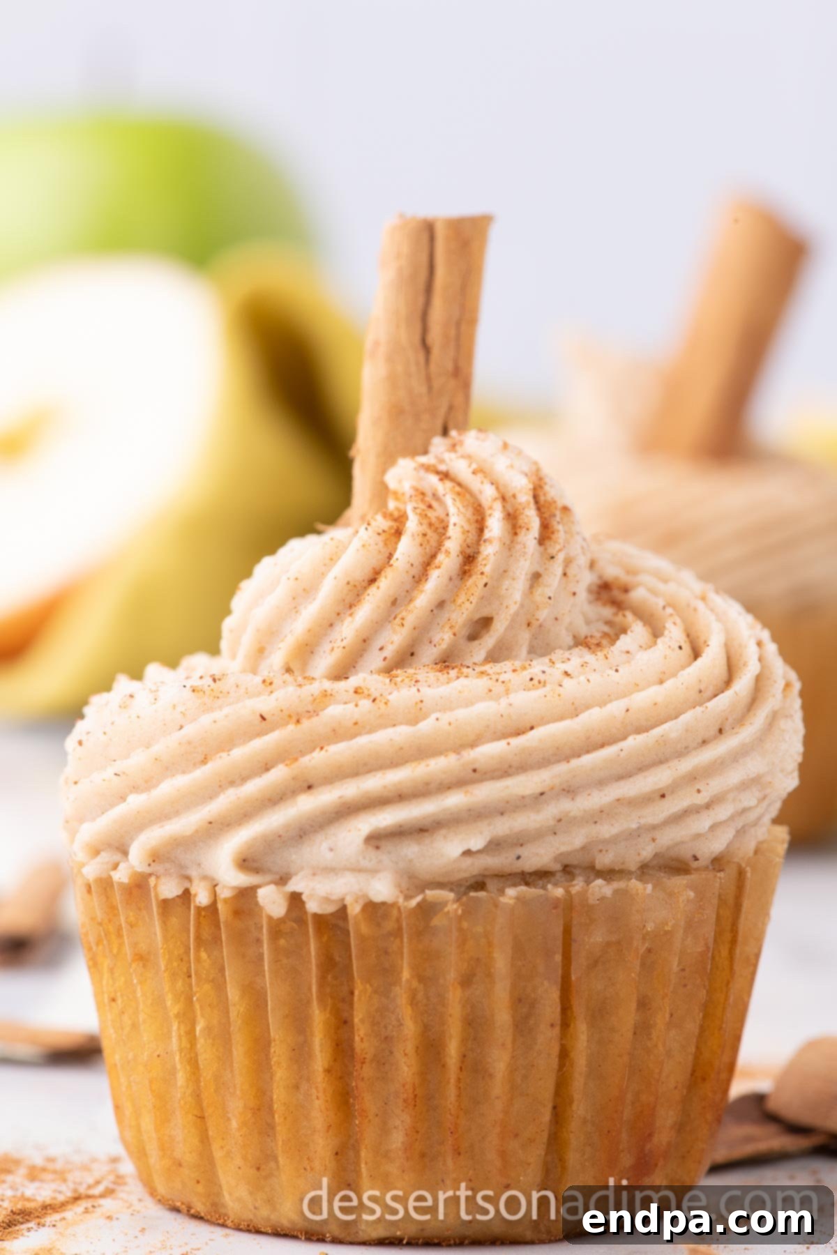 A beautifully frosted apple cider cupcake, ready to be enjoyed.