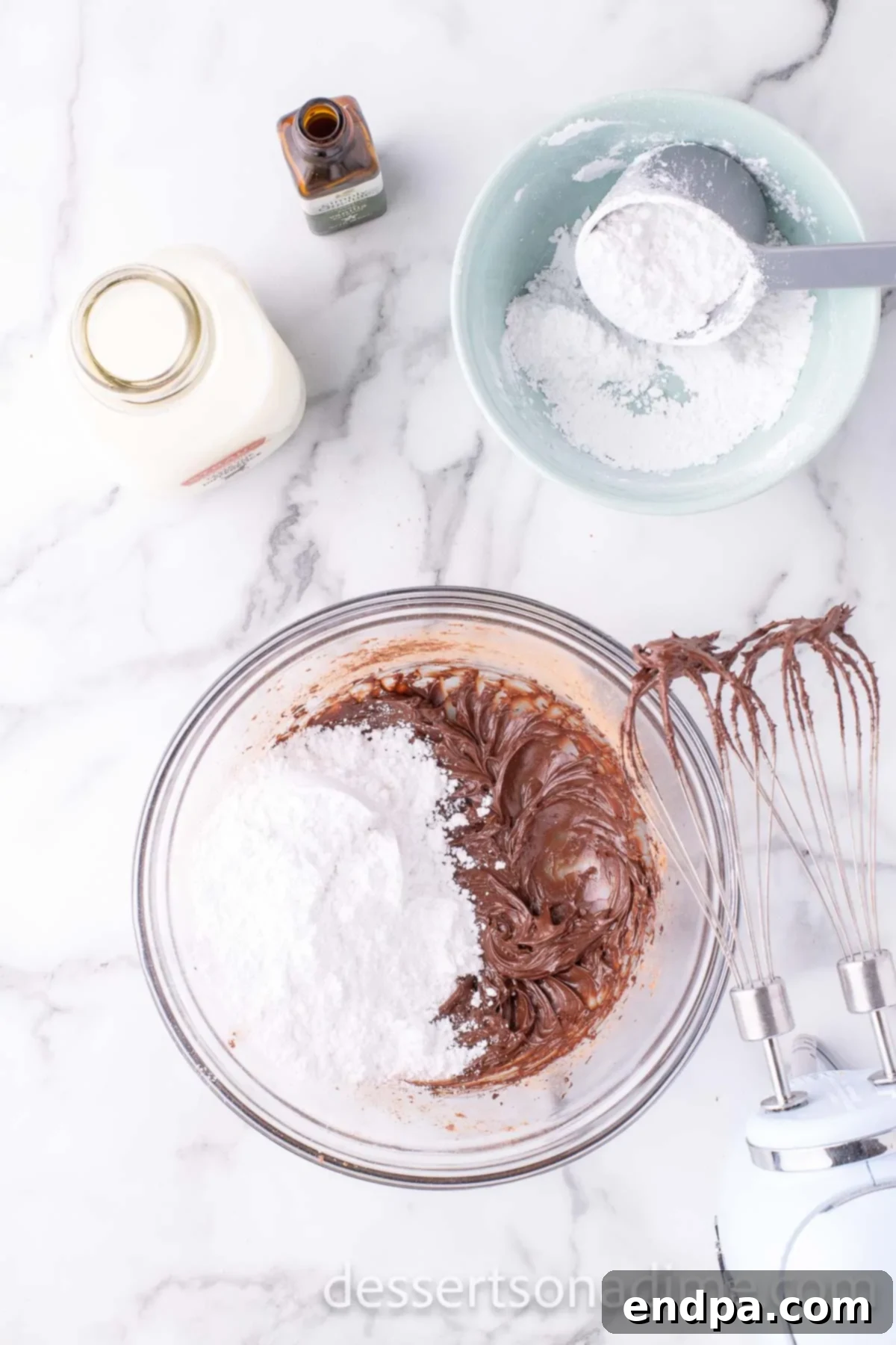 Powdered sugar added to frosting mixture.