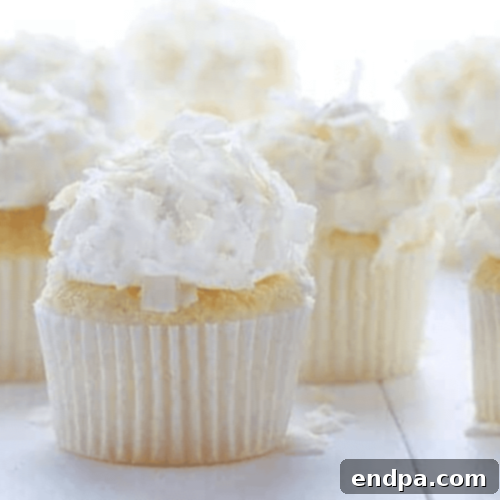 Tropical Coconut Angel Food Cupcakes, easy to make from a boxed mix with added coconut extract for extra flavor.
