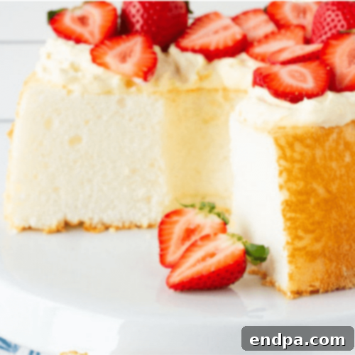 Angel Food Cake with Pineapple Whip, a colorful, light, and dreamy dessert with fresh strawberries.