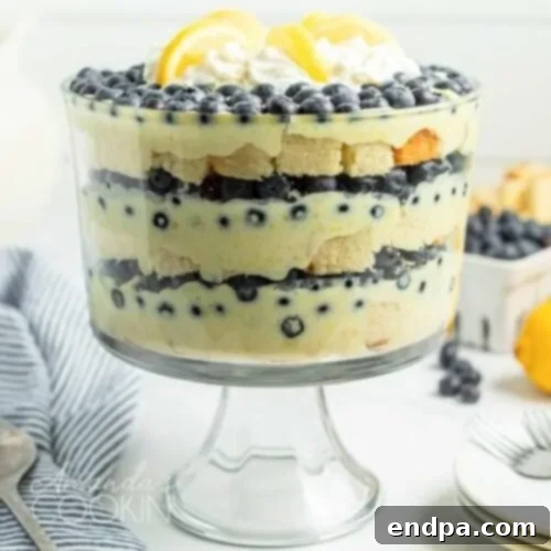 Bright Lemon Blueberry Trifle with layers of angel food cake, lemon pudding, and luscious blueberries.