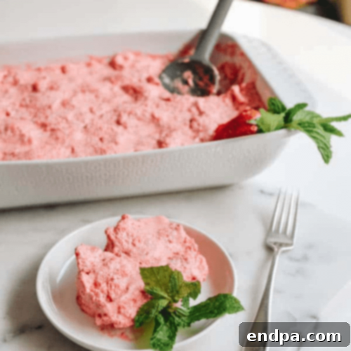 Nostalgic Strawberry Jello Angel Food Cake Dessert with cubed angel food cake and Jello for a quick pink treat.
