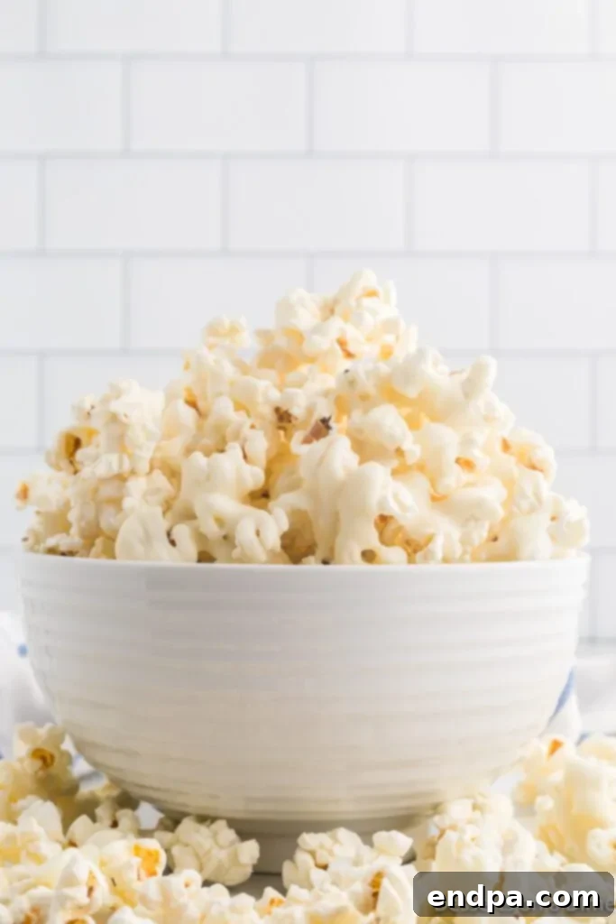 A large bowl filled with freshly made White Chocolate Popcorn, ready to be enjoyed.