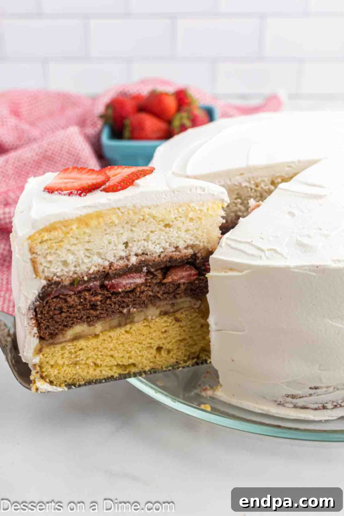 The Ultimate Atomic Cake 2 Atomic cake being sliced, revealing its colorful layers.