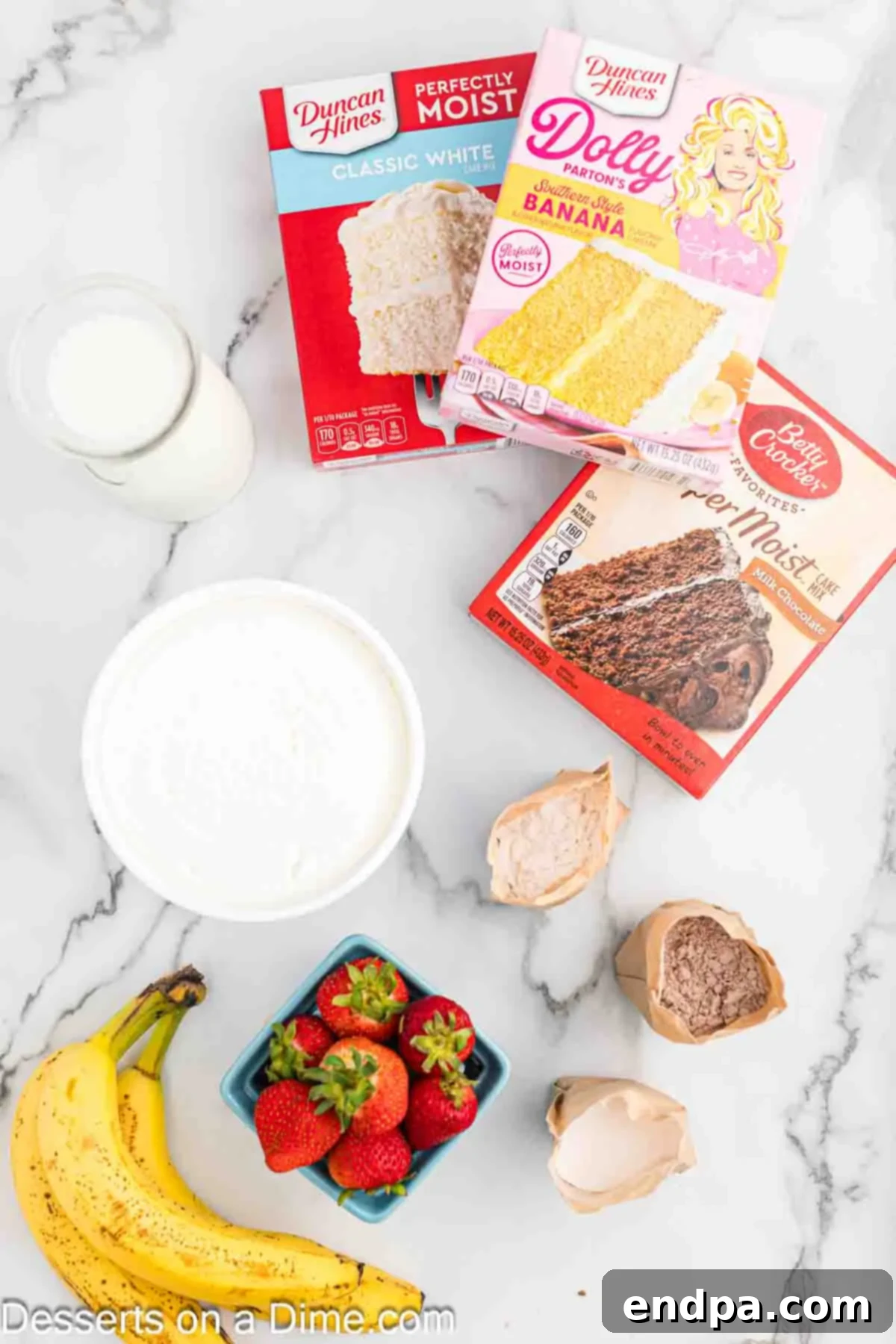 The Ultimate Atomic Cake 3 Ingredients for Atomic cake- banana cake mix, chocolate cake mix, white cake mix, bananas, strawberries, pudding mix and whipped cream.