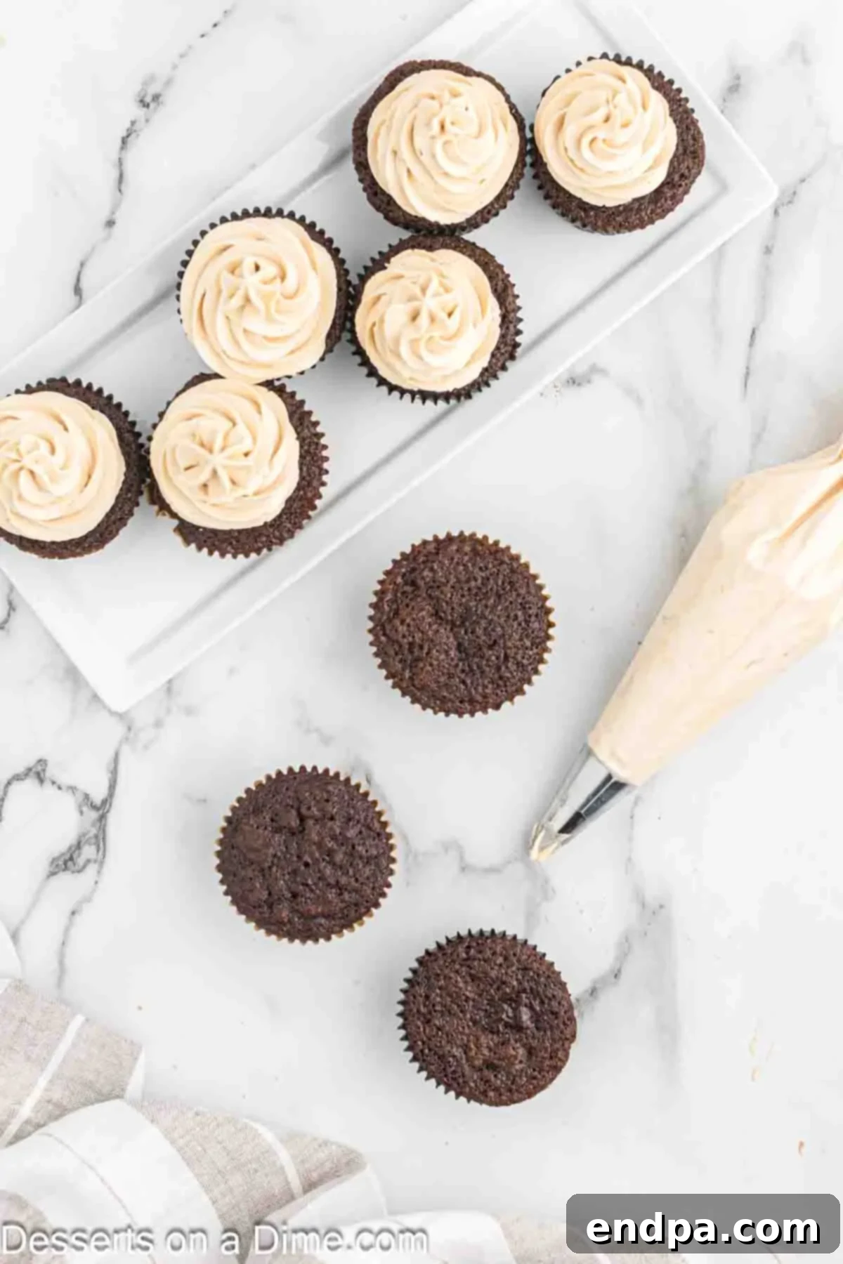 Decadent Mocha Treats 9 Piping bag with frosting piping frosting on each cupcake.