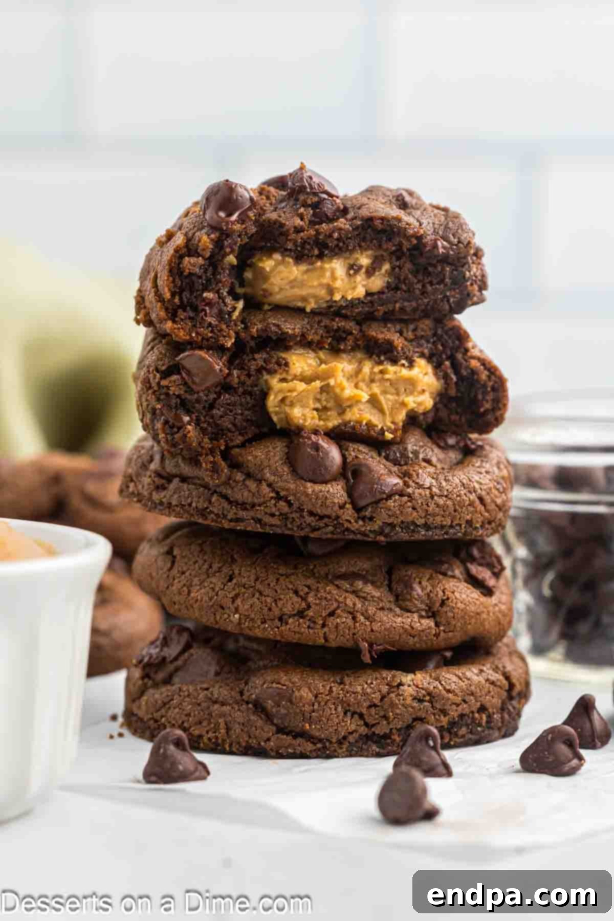 Peanut Butter Stuffed Chocolate Cookies stacked together. 