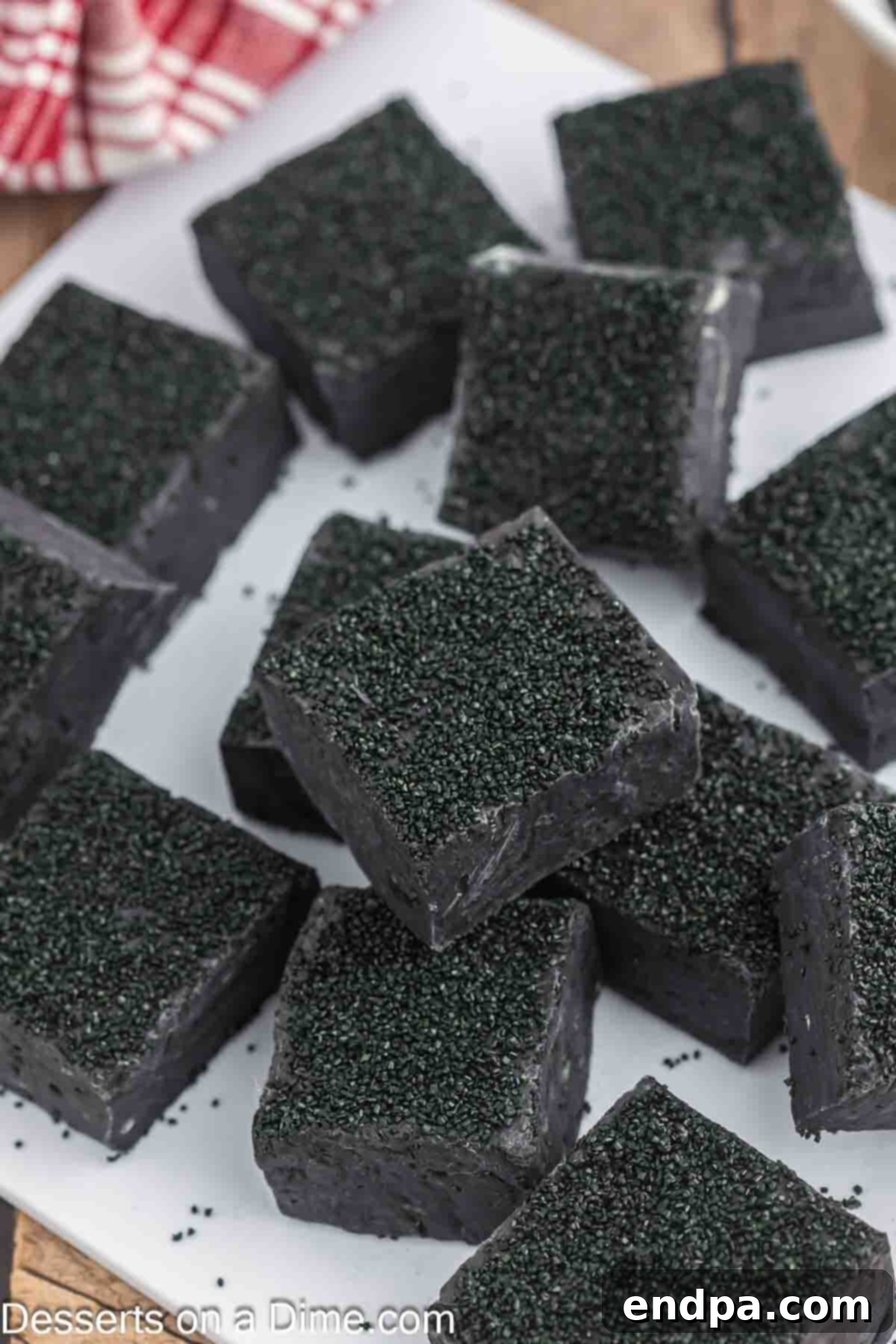 Naughty List Fudge 2 Christmas Coal Fudge cut into glistening black squares, ready to be served or gifted.