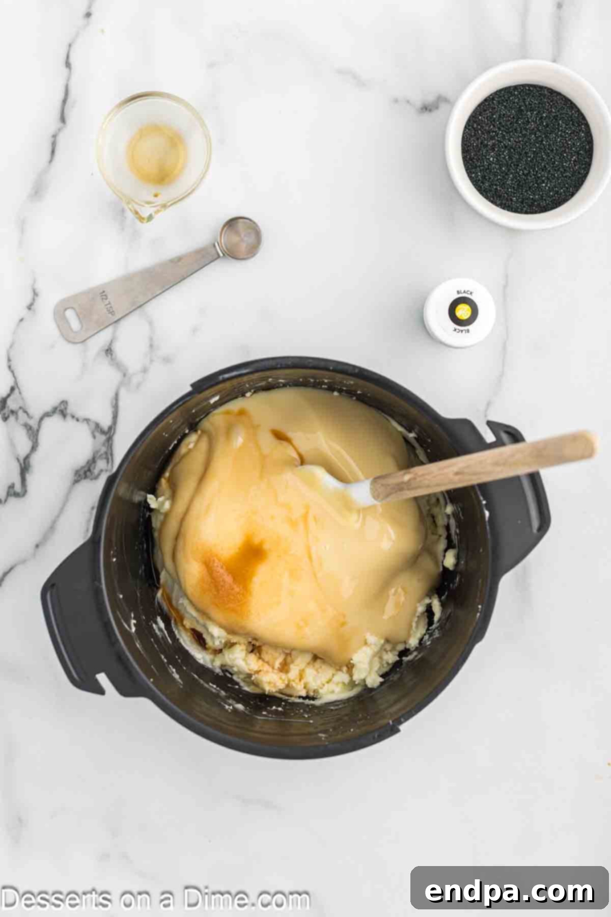 Naughty List Fudge 5 Sweetened condensed milk being poured into the melted chocolate mixture.