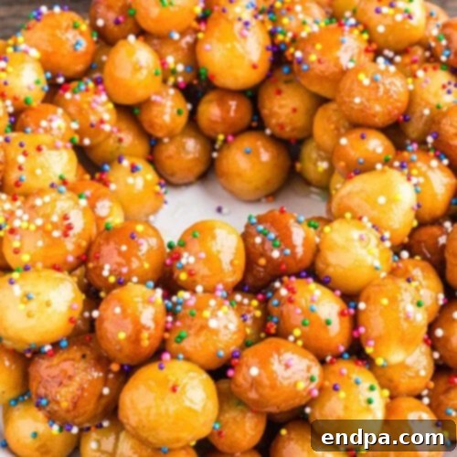 A wreath of Struffoli with sprinkles.