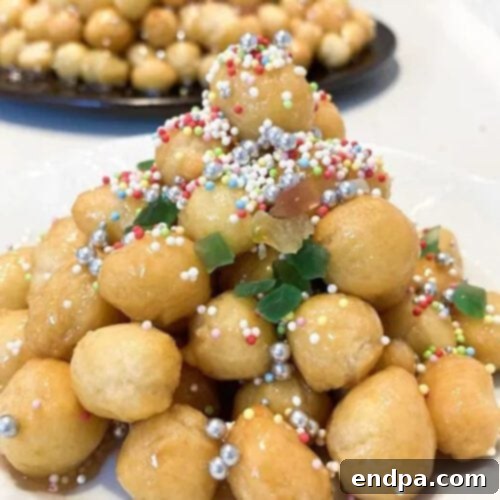 A plate of Honey Balls with sprinkles.