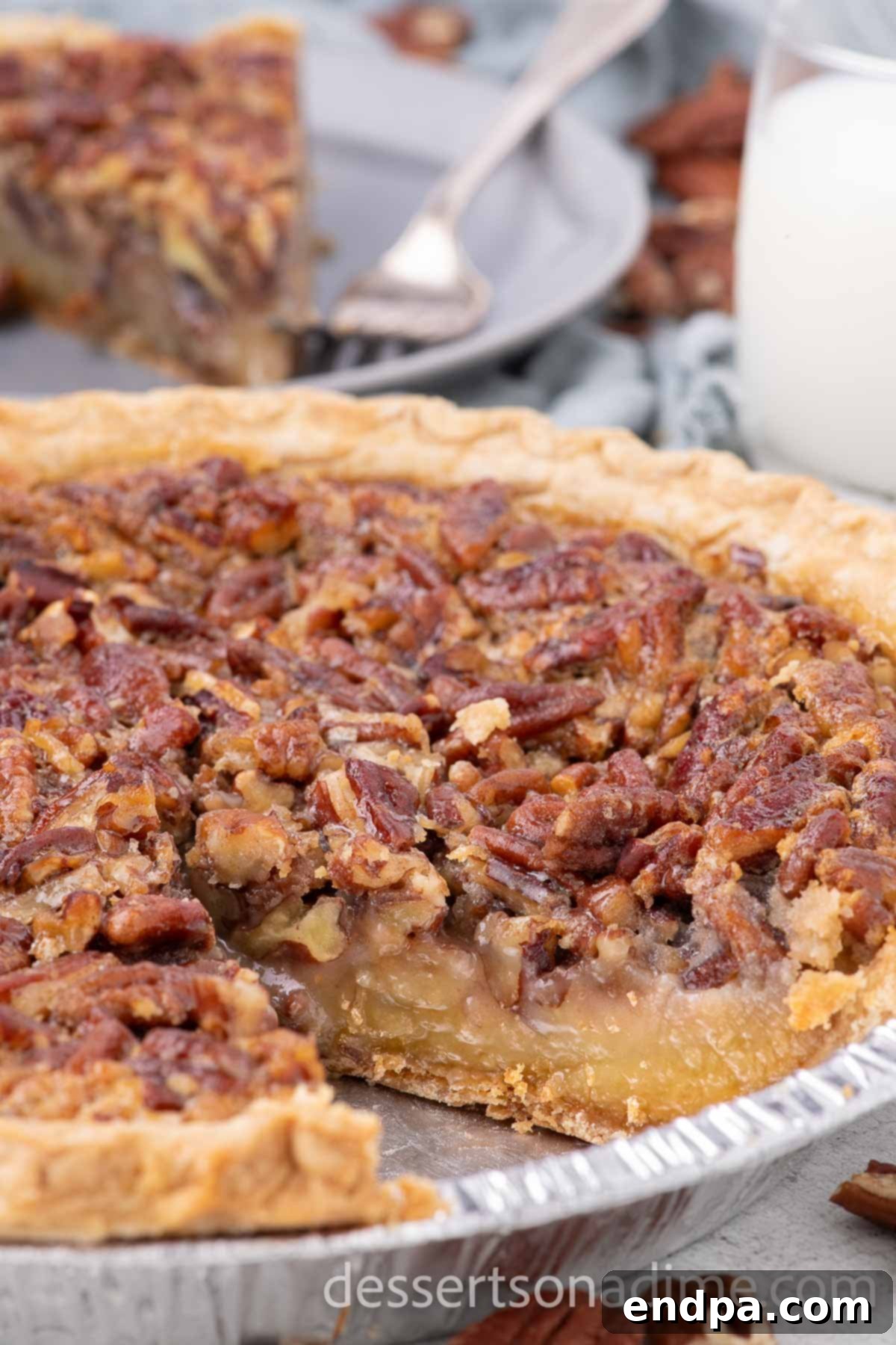 A perfectly baked Texas Pecan Pie, cooled and sliced into generous wedges, ready to be served.