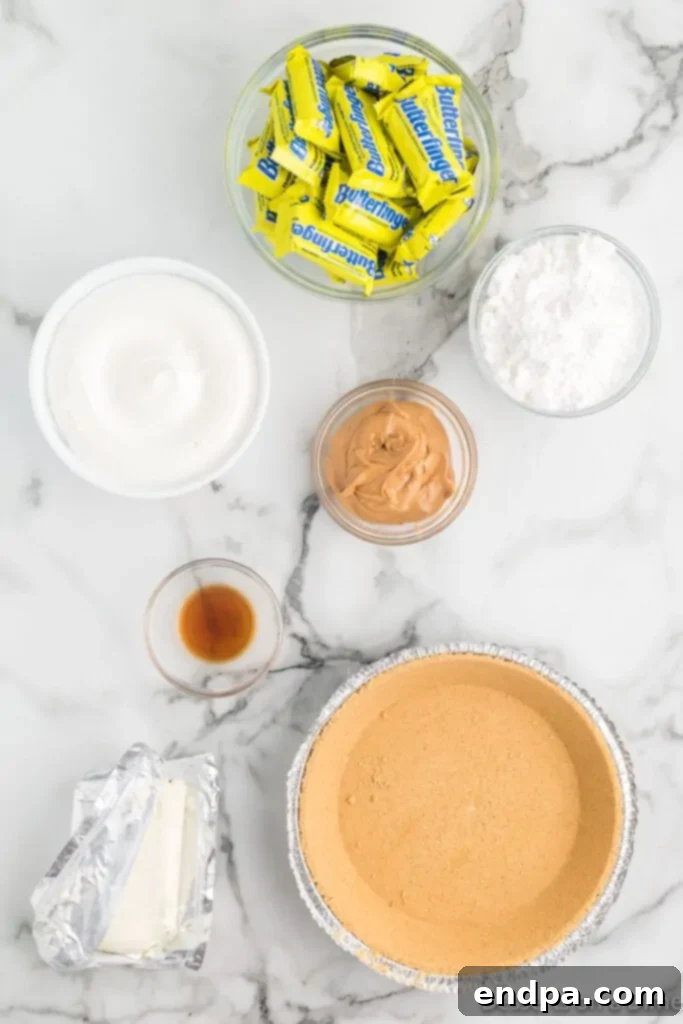 Decadent Butterfinger Crunch Pie 3 Ingredients for Butterfinger Pie- pie crust, cool whip, powdered sugar, peanut butter, cream cheese, vanilla.