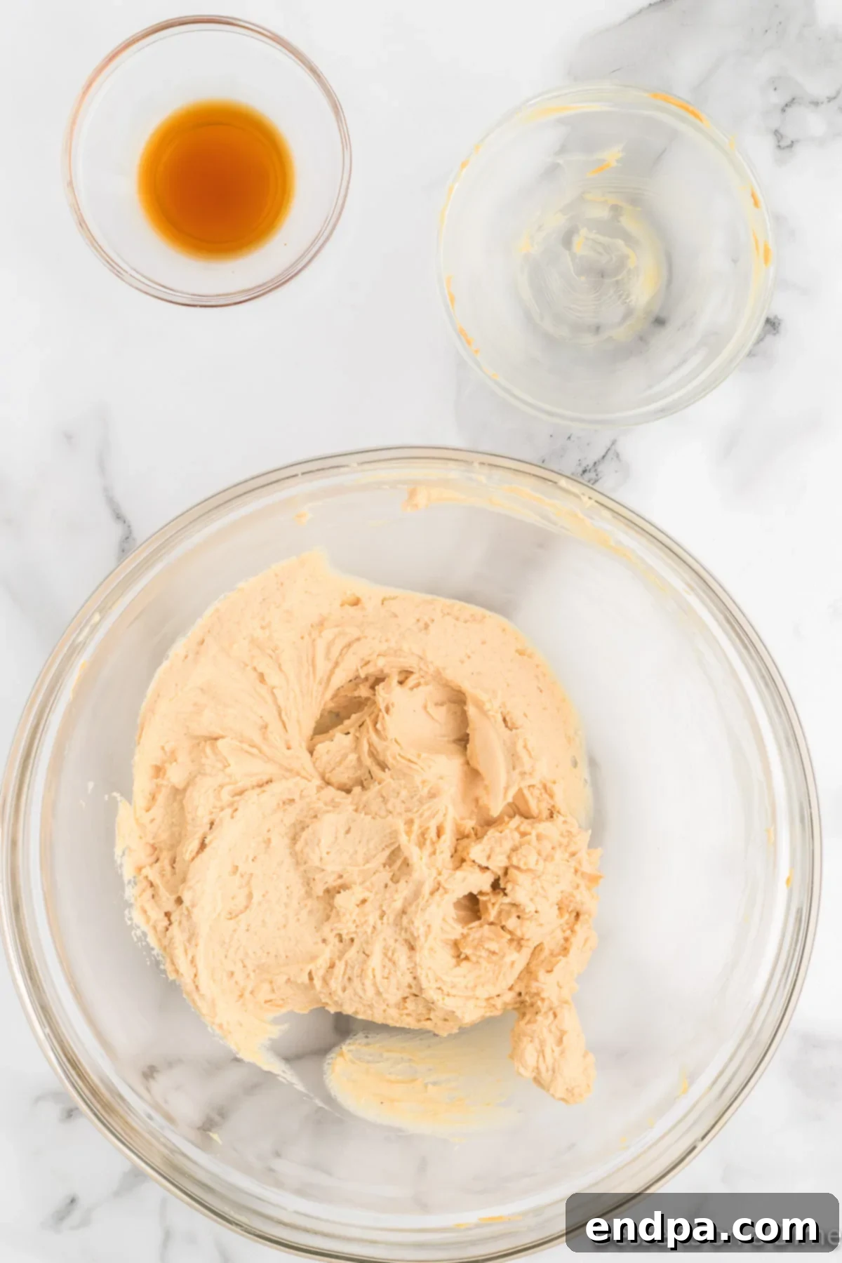 Decadent Butterfinger Crunch Pie 4 Bowl of cream cheese and peanut butter mixture being combined.