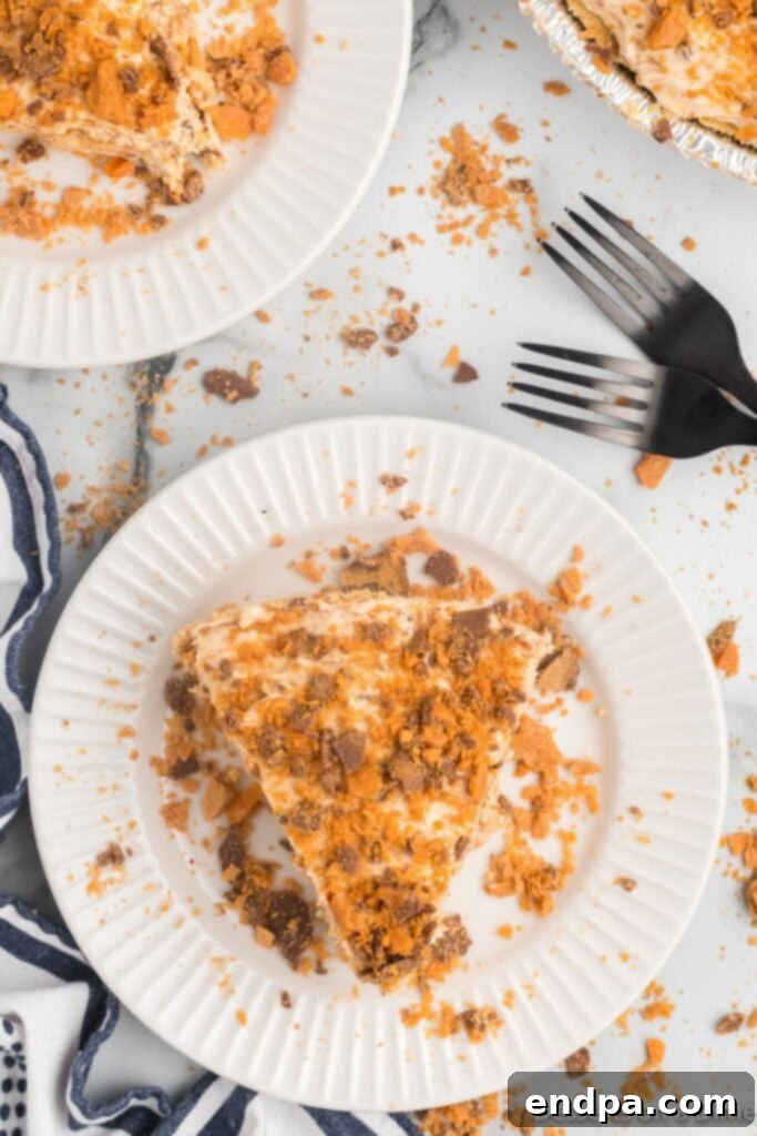 Decadent Butterfinger Crunch Pie 10 Slice of pie on a plate, ready to eat.