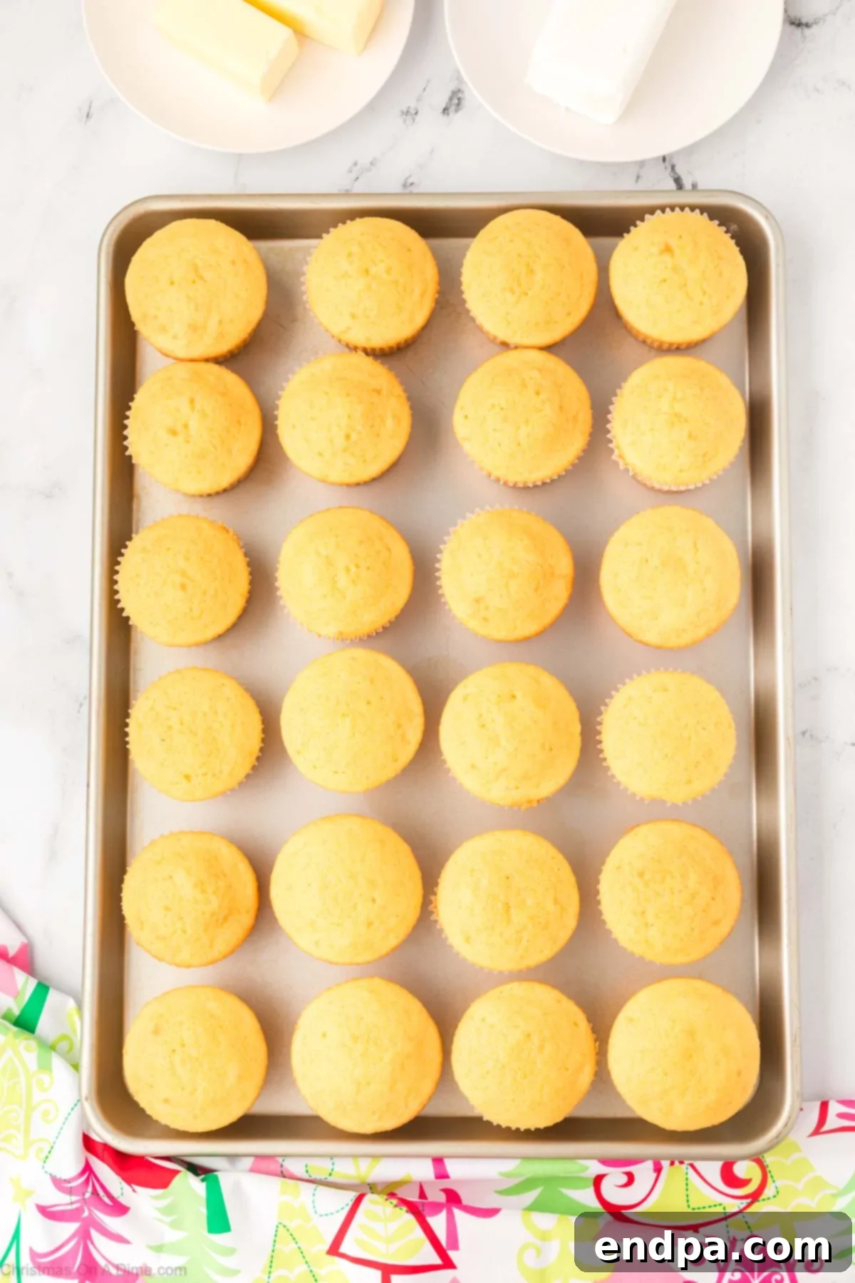 Cupcakes cooling on a wire rack after baking.