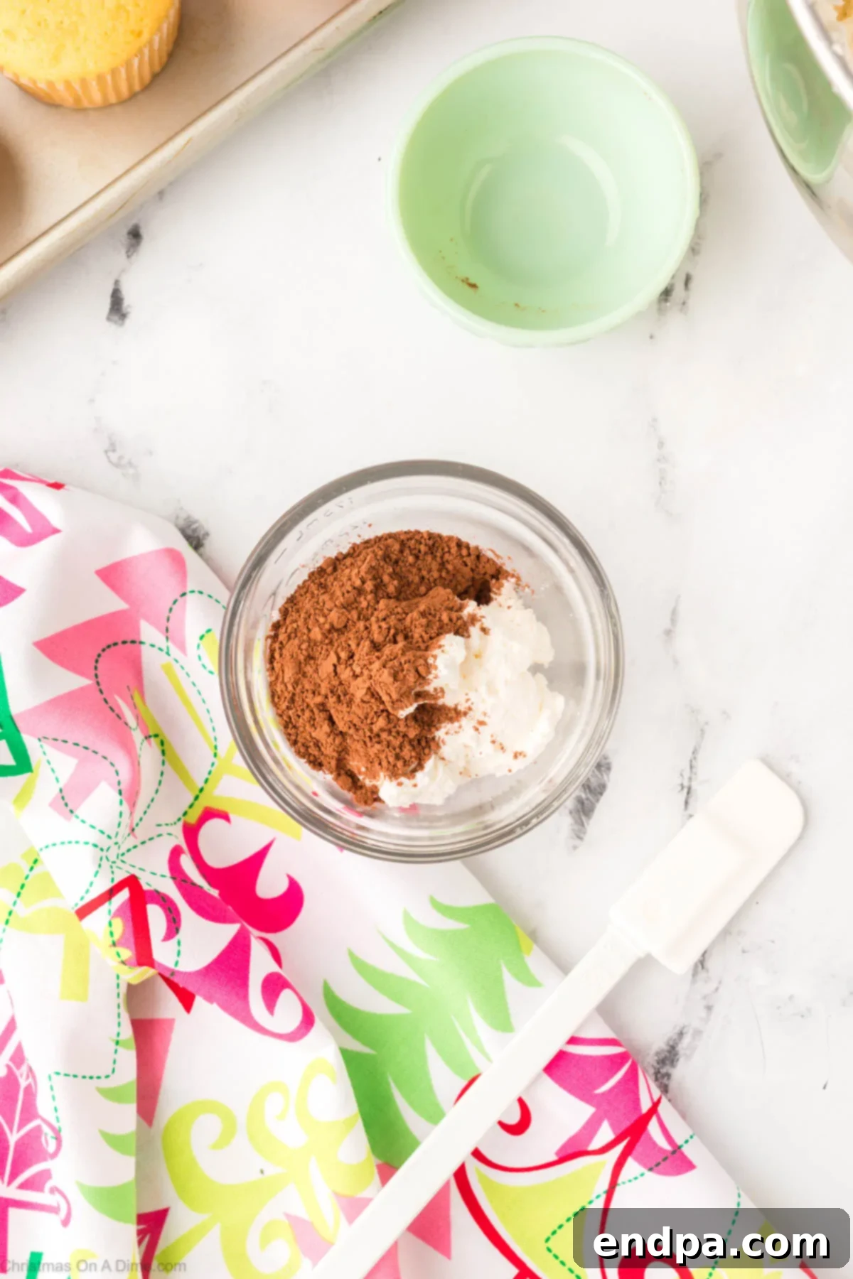 A small bowl of frosting with cocoa powder mixed in for the tree trunk.