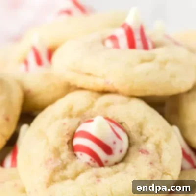 Sweet Yuletide Treasures 16 Candy Cane Kiss Cookies Recipe, a festive and quick treat with tons of peppermint flavor.