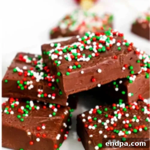 Sweet Yuletide Treasures 25 Christmas Fudge, a creamy and smooth classic chocolate fudge, easy to make for holiday parties and gifts.