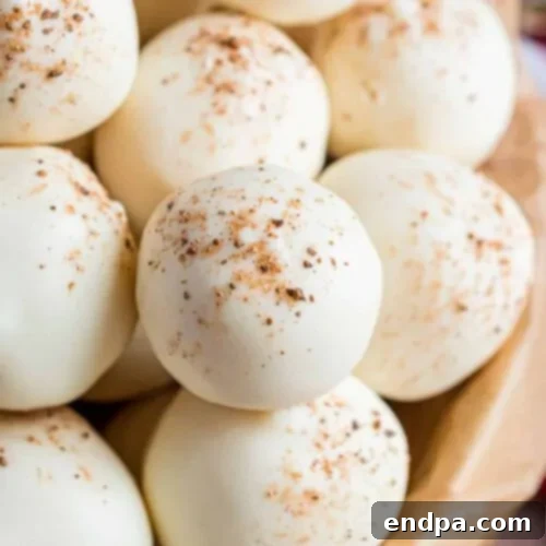 Sweet Yuletide Treasures 29 Eggnog Truffles, homemade truffles with real eggnog in the creamy center, topped with white chocolate and nutmeg.