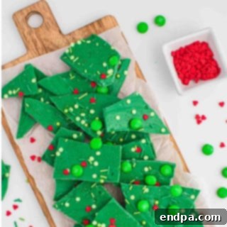Sweet Yuletide Treasures 6 Grinch Bark recipe, a fun and festive dessert topped with sprinkles and red hearts, perfect for the holidays.