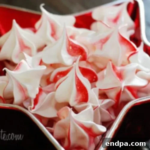 Sweet Yuletide Treasures 34 Peppermint Meringues, light and airy swirls perfect for the peppermint season, ideal for cookie exchanges.