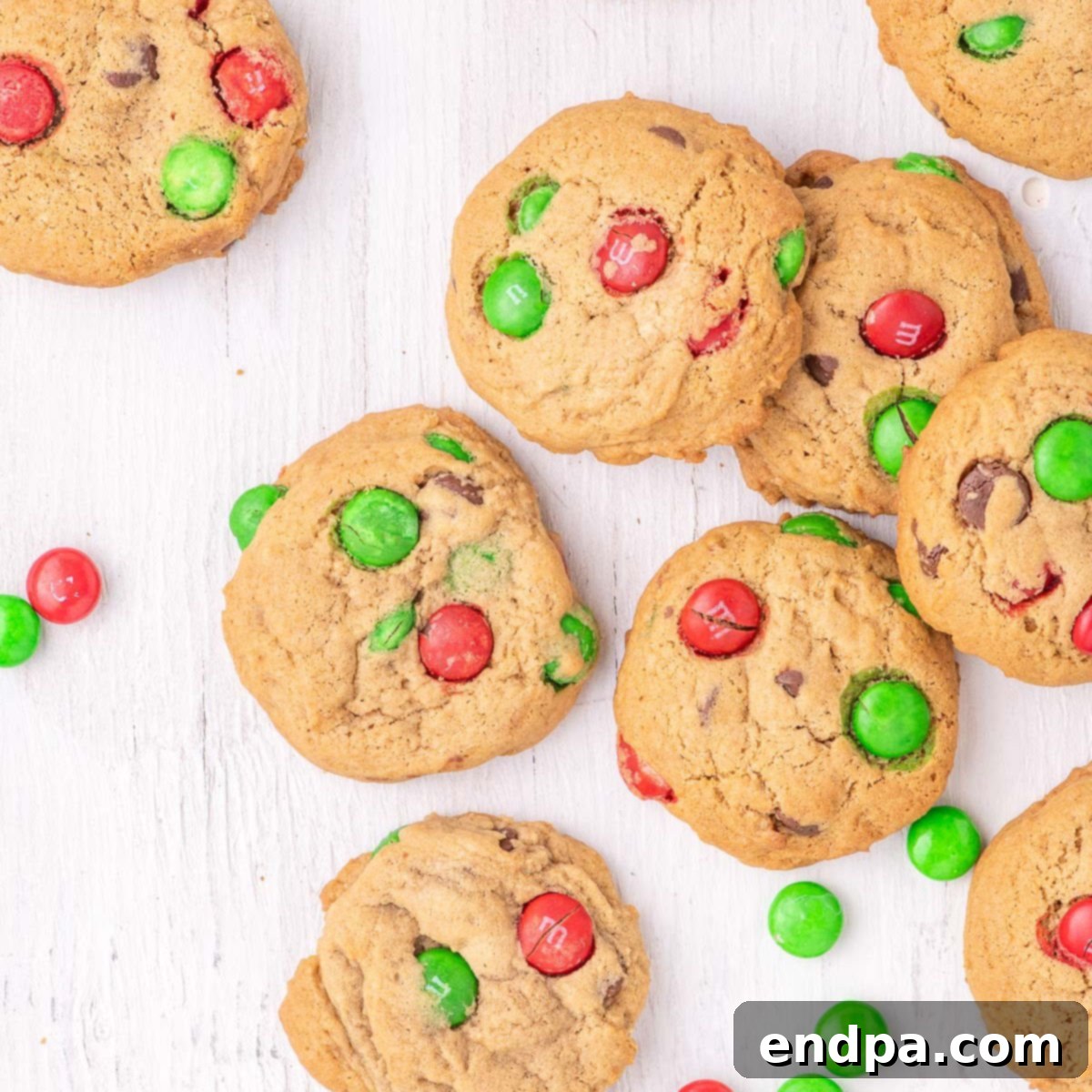 Large, chewy M&M Christmas Cookies on a platter, showcasing their festive red and green colors.