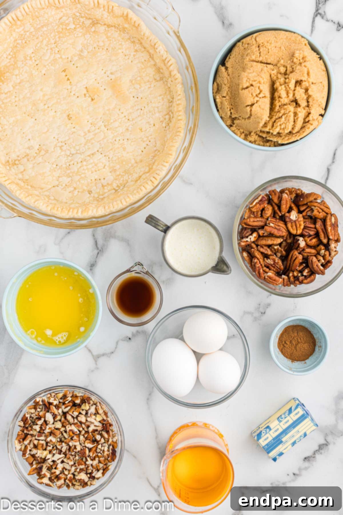 Paula Deen's Southern Comfort Pecan Pie 3 Ingredients for pecan pie, including pecan halves, pie crust, corn syrup, brown sugar, eggs, vanilla, cinnamon, butter, heavy cream, and chopped pecans.