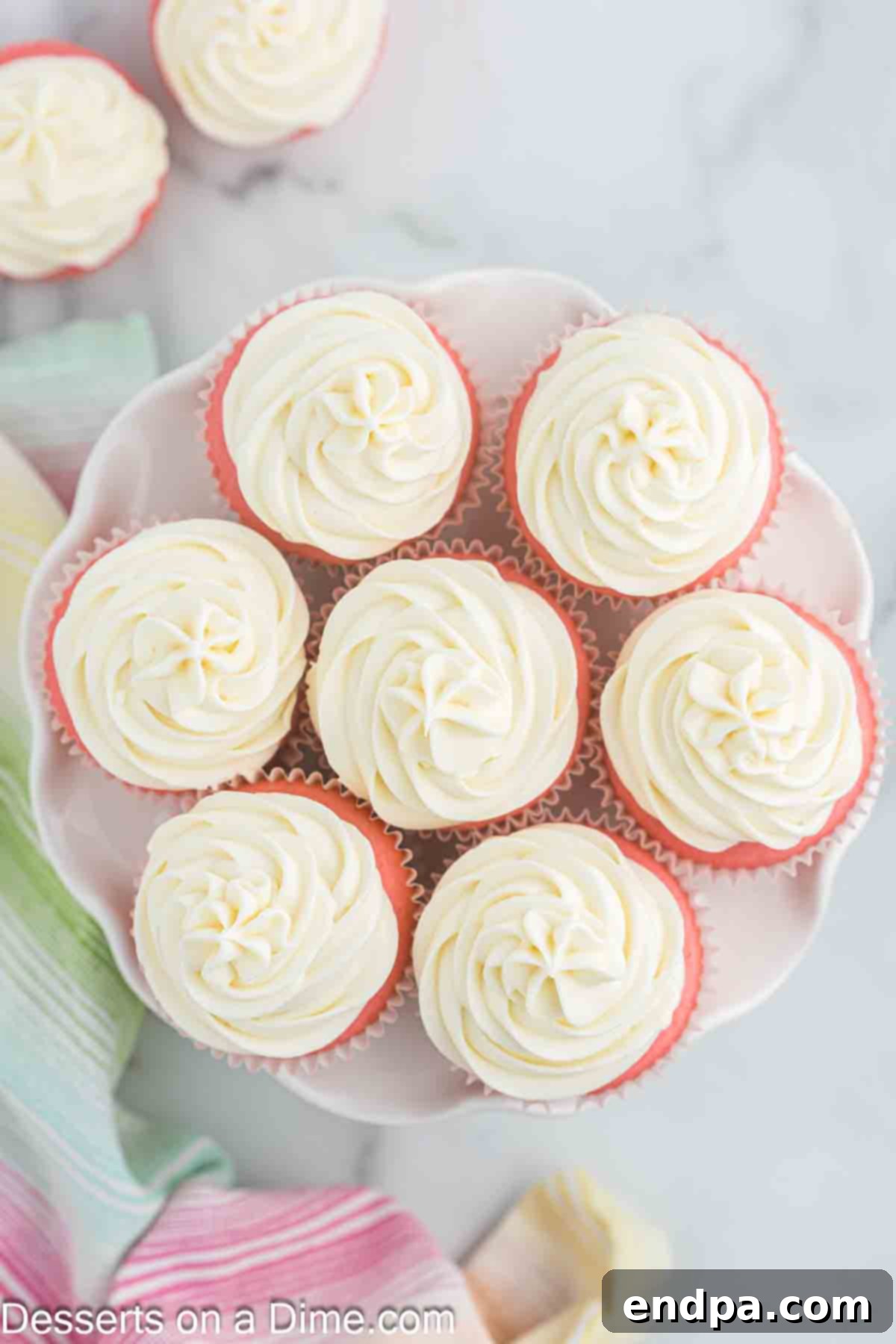 A platter of beautifully decorated Pink Velvet Cupcakes, ready to be served.