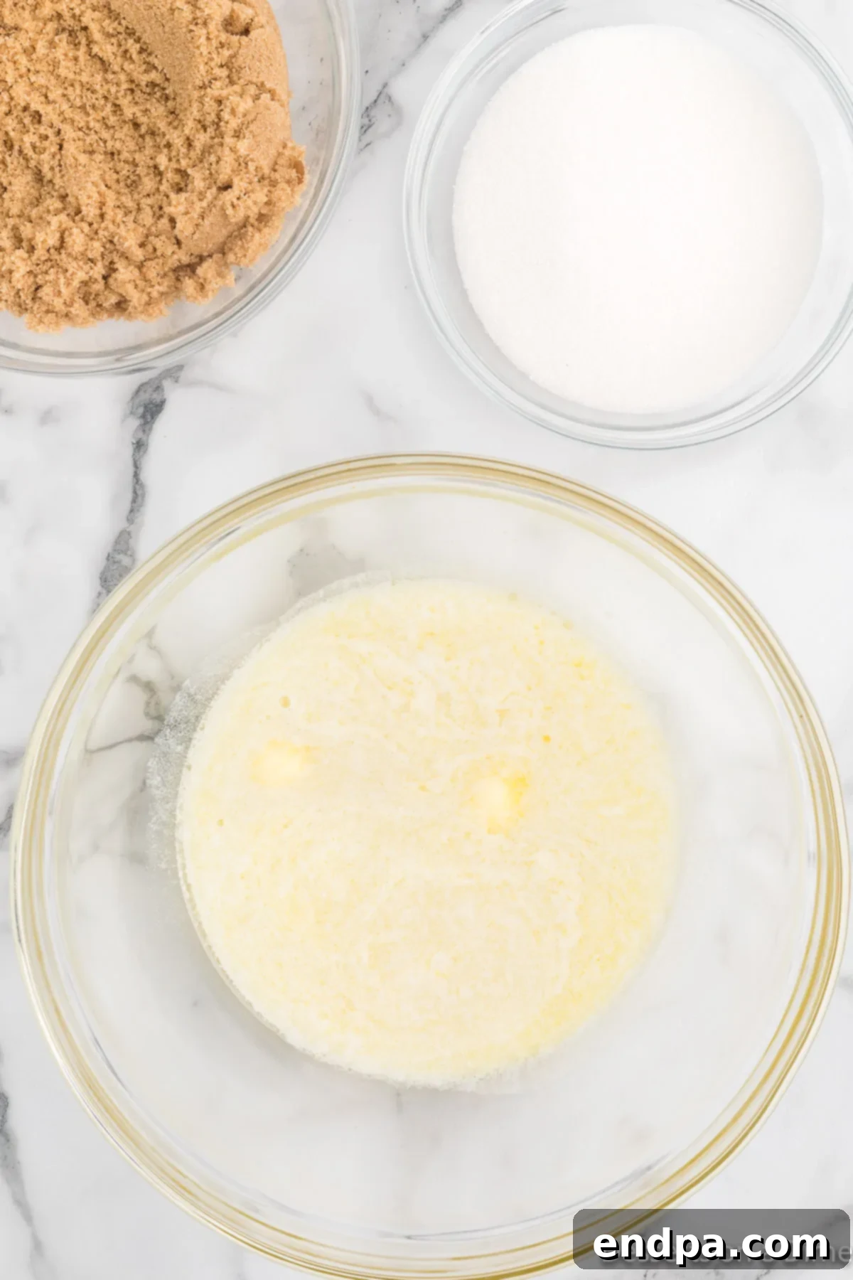 Eggs and butter mixed together in a bowl. 