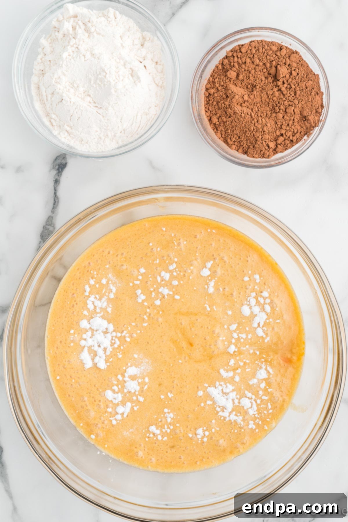 Cocoa powder, flour and salt added to mixture. 