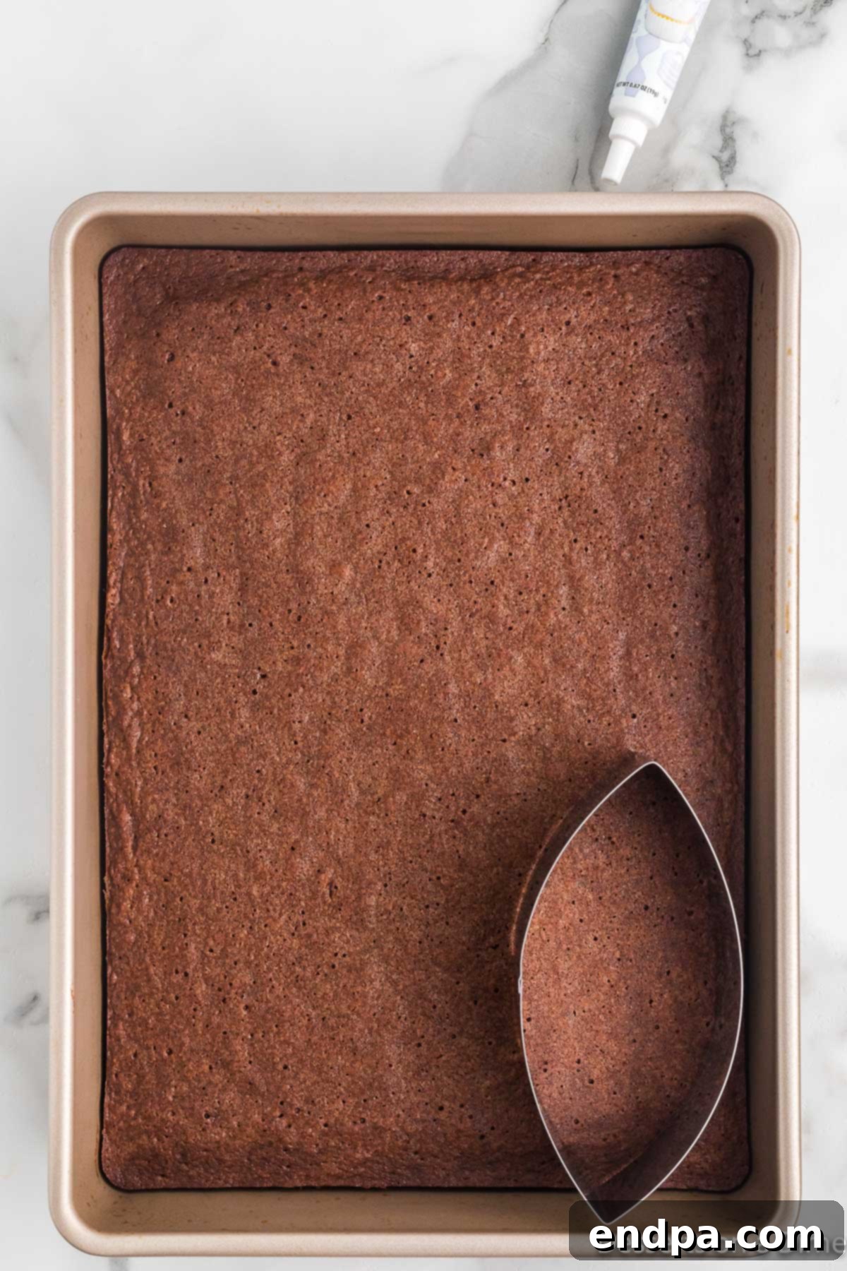 Cookie Cutter making football shapes. 