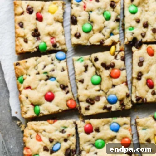 Thick and chewy M&M Cookie Bars made with basic pantry staples.