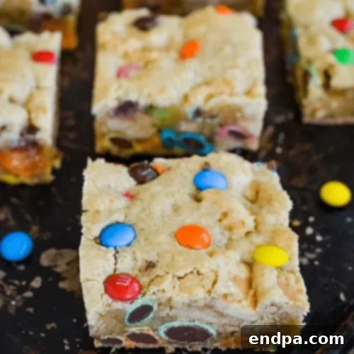 Chewy M&M Blondie Brownies, a delightful combination of two classic sweets.