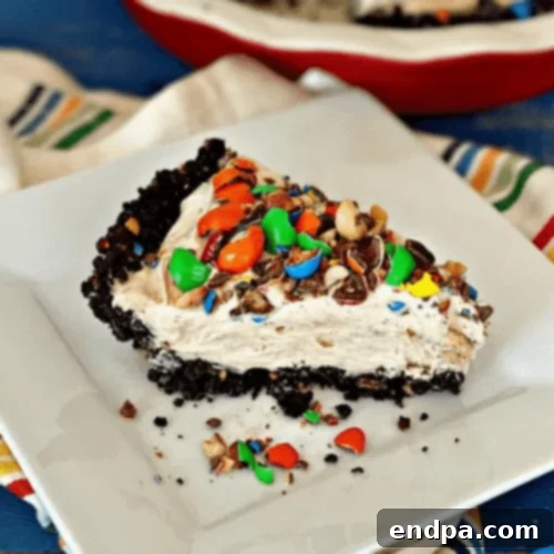 Creamy Peanut M&M Peanut Butter Pie with an Oreo and Peanut M&M cookie crust.