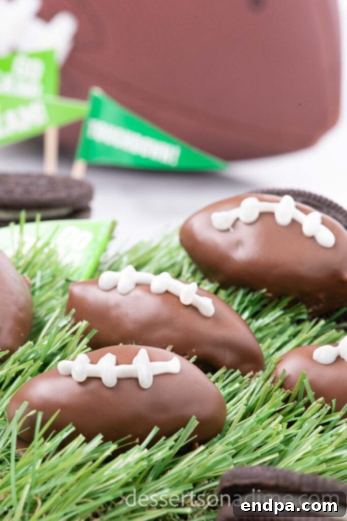 Festive Football Shaped Oreo Balls on faux grass, arranged creatively.