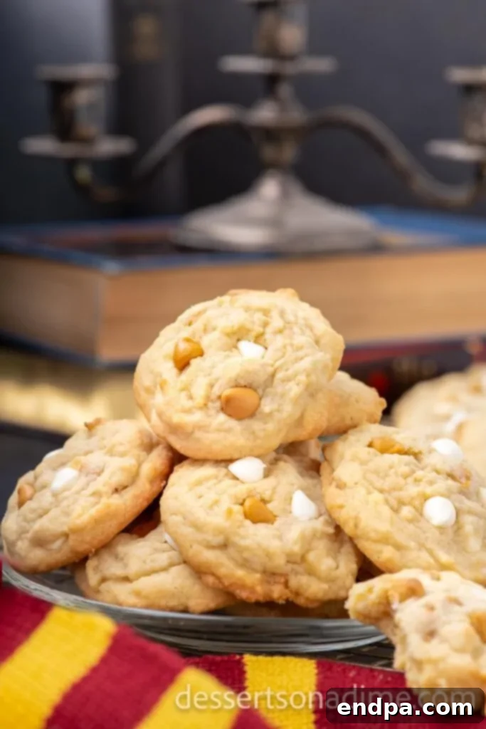 Hogsmeade's Secret Butterbeer Cookie Recipe 8 Perfectly baked Harry Potter Butterbeer Cookies, stacked on a plate, ready to be enjoyed.