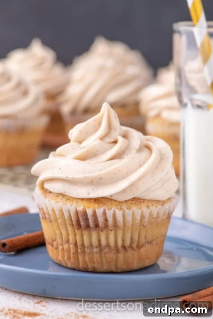 Heavenly Snickerdoodle Cupcakes 12 close up image of a snickerdoodle cupcake on a plate