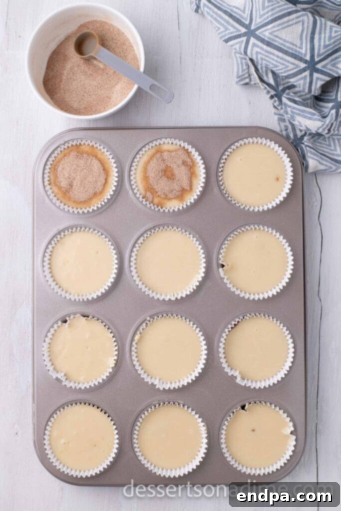 Heavenly Snickerdoodle Cupcakes 8 Filling the cupcake liners with cinnamon sugar mixture and cupcake batter