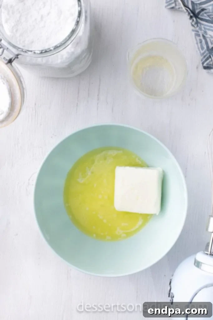 Heavenly Snickerdoodle Cupcakes 9 Beating butter and cream cheese together