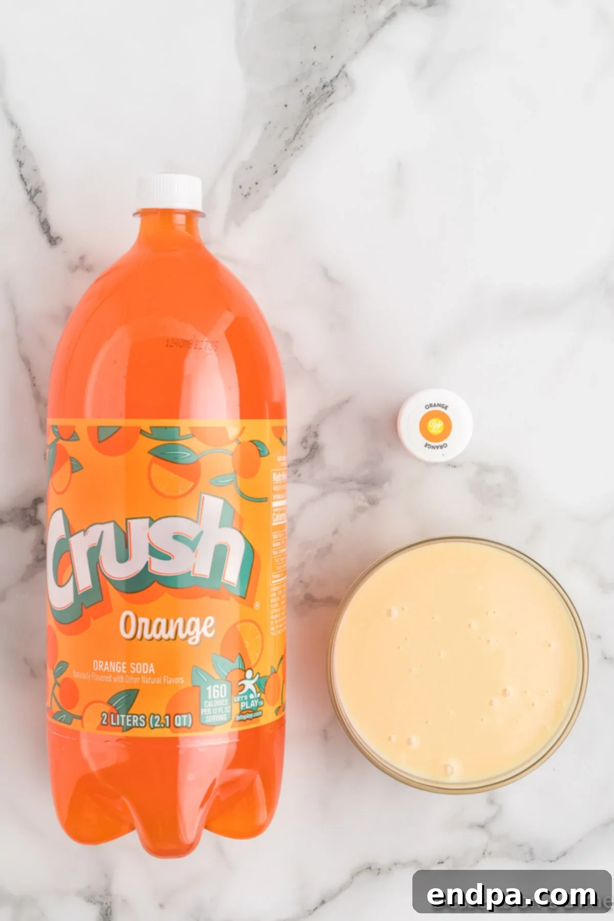 Sunset Swirl 3 Ingredients for homemade orange sherbet: sweetened condensed milk, orange soda, and orange food coloring.